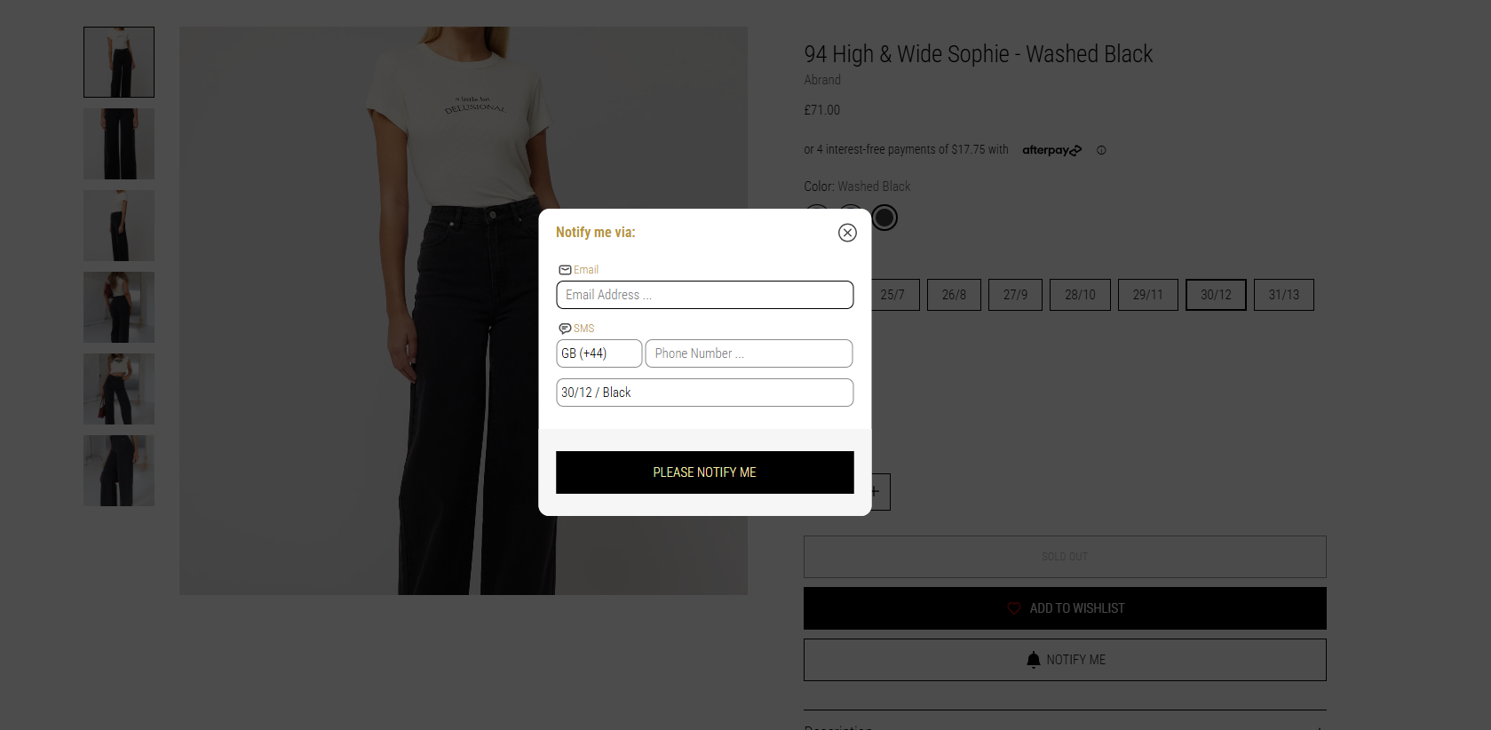 Notify me via popup form with email and SMS fields for restocking updates on black jeans product page