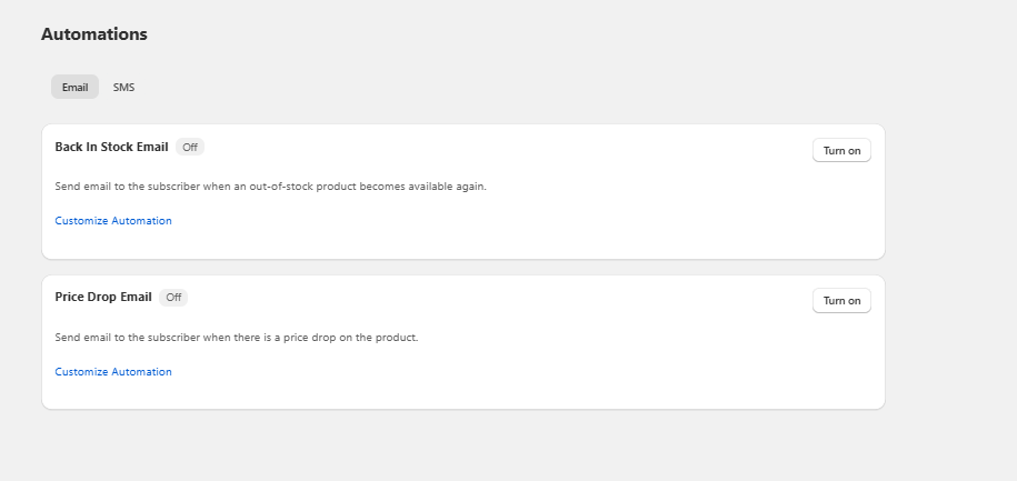Automations settings page showing two email options: Back In Stock Email and Price Drop Email, both currently off with Turn o
